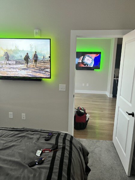 Two-Room TV Mounting with LED Backlighting