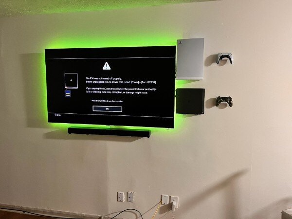 Gaming Setup with TV, Soundbar, Console Shelves and LED Lighting